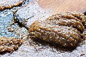 Almond-sugar mixture for baking on a wooden board