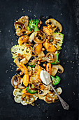 Cauliflower, romanesco, broccoli, apricots, mushrooms and chickpeas, with hummus as a dip (vegan)