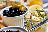 A Mediterranean appetizer platter with olives and pickled cheese