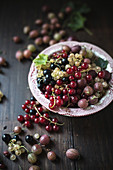 An arrangement of gooseberries and various redcurrants