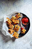 Homemade mini (cocktail) sausage rolls with ketchup