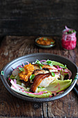 Porchetta with apricot chutney and pickled red onion
