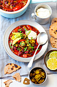 Vegetarian chili with avocado and sour cream