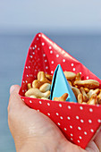 Snacks served in handmade paper boat