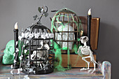 DIY Halloween decorations: bird skeleton in cage and skull in cage