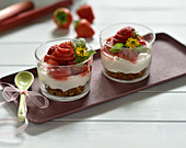 Vegan cream cheese dessert with biscuit base and strawberry-rhubarb compote