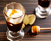 Highlander (hot alcoholic coffee beverage with honey, ginger whiskey and cream)