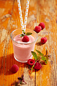 Mango and raspberry smoothie with agave, yoghurt, milk and mint