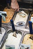Various ice creams in metal containers