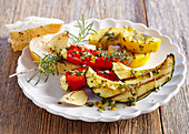 Grilled mini peppers filled with feta cheese, and grilled courgette with unleavened bread