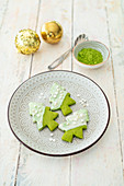 A shortbread Christmas tree with matcha powder and white chocolate
