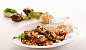 Grilled young artichokes with tomato and olive vinaigrette and white bread