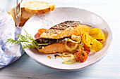 Grilled salmon fillet with grilled vegetables and white bread