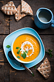 Vegan carrot soup with unleavened bread