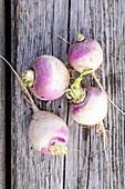 White turnips on a wooden surface