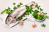 Whole fresh trout with fresh herbs