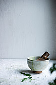 A bowl of matcha tea being stirred