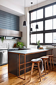 Masculine kitchen with industrial window and kitchen counter