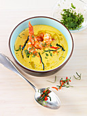 Ginger, carrot and coconut soup with prawns