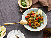 Quinoa with roasted vegetables, rocket and lemon