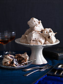 Chocolate meringues served with blackberries and cream