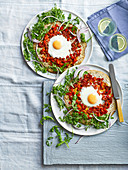 Fried egg pizza with peppers and rocket