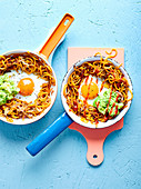 Sweet potato noodles with fried egg and avocado puree