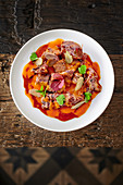 Ox tongue in a red and yellow pepper sauce