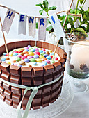 Cake with chocolate and colorful chocolate beans