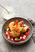 Pumpkin and tomato curry with baked prawns