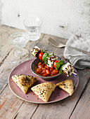Mediterranean feta cheese skewers with tomatoes and herb bread