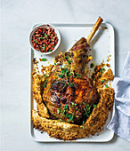 Salt-baked leg of lamb with sundried tomato tapenade