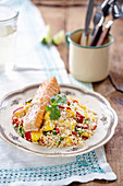 Salmon on couscous salad with peppers