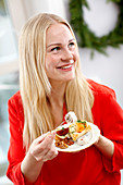 Smiling woman with food on her plate