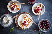 Homemade waffles with vanilla ice cream and gooseberry jam