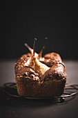 Vegan chocolate cake with baked pears, glazed with elderflower jelly