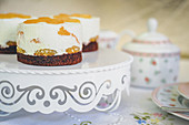 Sponge cakes topped with cream cheese and mandarins