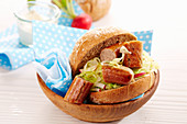 Bratwurst in a wholemeal roll with coleslaw