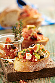 Crostini with figs, tomatoes, olives, feta and thyme