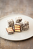 Lamingtons (sponge cake with raspberry jelly, chocolate and coconut flakes, Australia)