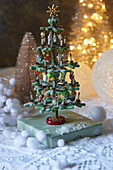 Tiny decorated Christmas tree ornament