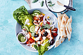 Deconstructed greek salad with salmon