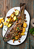 Salmon trout with potatoes and chanterelle mushrooms