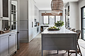 Large classic kitchen in grey with coffered fronts and kitchen island