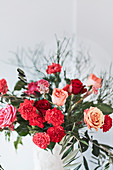 Bouquet of roses, carnations and olive branches