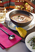 Mushroom cream soup in a brown soup bowl