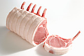 Raw pork chops, with a cutlet sliced off