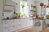 Island counter in white kitchen