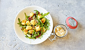 Italian gnocchi salad with rocket and dries tomatoes