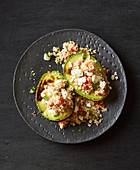Roasted avocados with couscous and sheep's cheese
